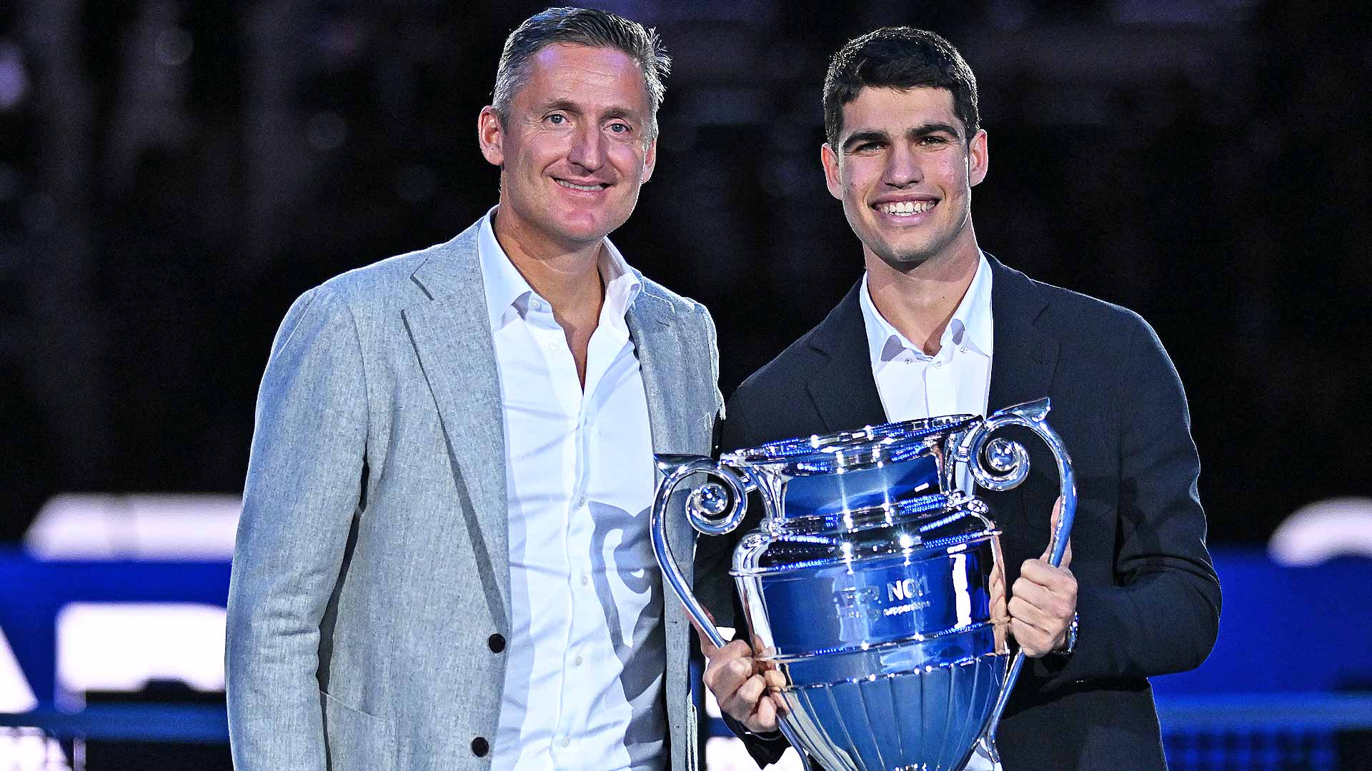 ATP Chairman Andrea Gaudenzi presents Carlos Alcaraz with the year-end ATP No. 1 Trophy presented by Pepperstone at the Nitto ATP Finals in November.