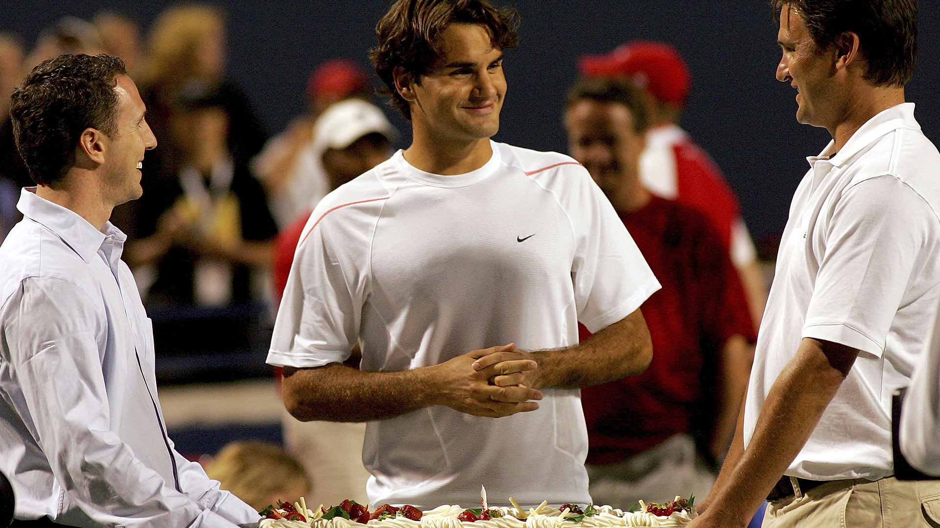 <a href='https://www.atptour.com/en/players/roger-federer/f324/overview'>Roger Federer</a> of Switzerland is presented a cake celebrating his 25th birthday following a win at the Rogers Cup