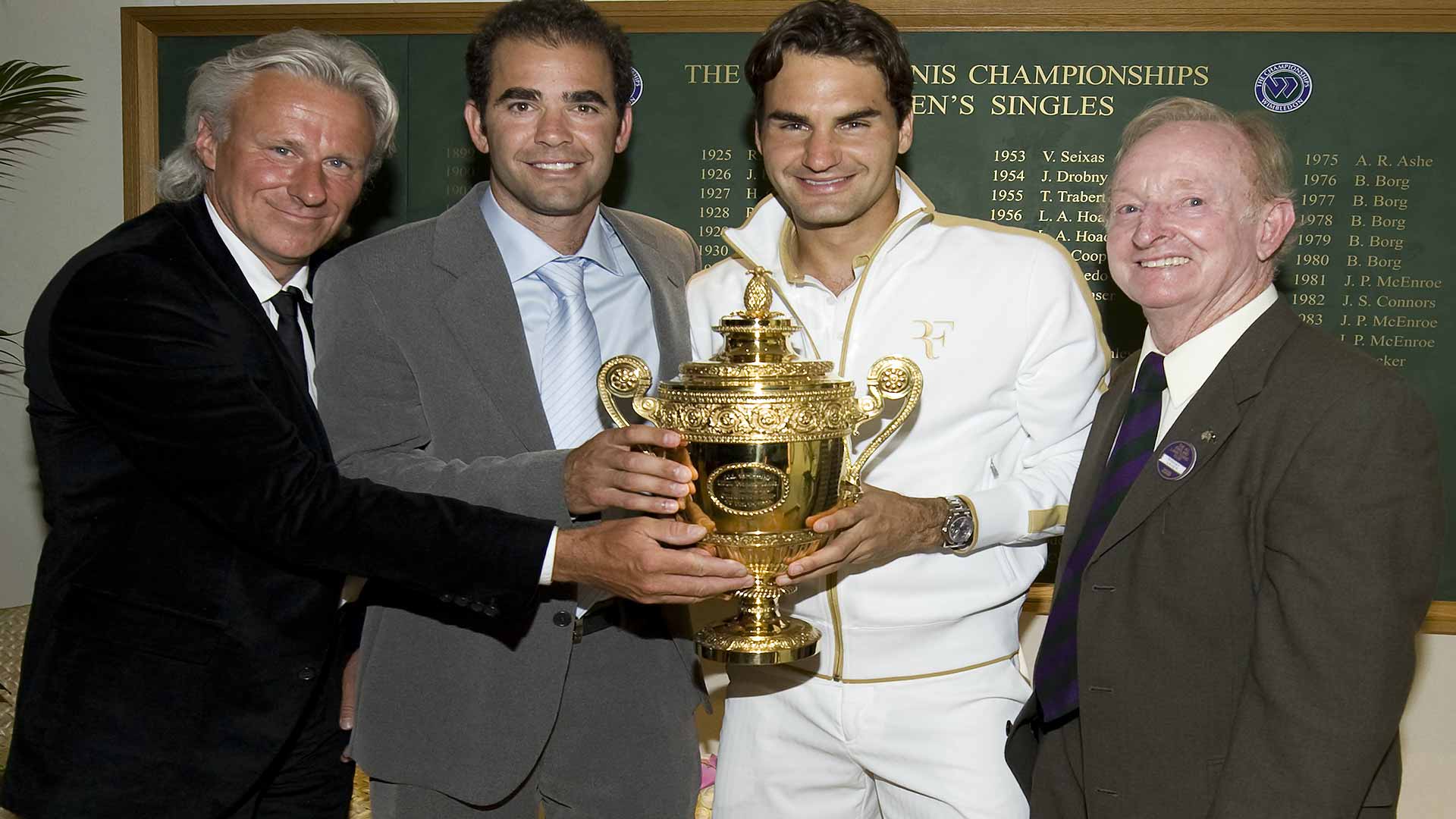 <a href='https://www.atptour.com/en/tournaments/wimbledon/540/overview'>Wimbledon</a> champion <a href='https://www.atptour.com/en/players/roger-federer/f324/overview'>Roger Federer</a> poses for a photo with former tennis champions <a href='https://www.atptour.com/en/players/bjorn-borg/b058/overview'>Bjorn Borg</a>, <a href='https://www.atptour.com/en/players/pete-sampras/s402/overview'>Pete Sampras</a> and <a href='https://www.atptour.com/en/players/rod-laver/l058/overview'>Rod Laver</a> following his 2009 win over <a href='https://www.atptour.com/en/players/andy-roddick/r485/overview'>Andy Roddick</a>