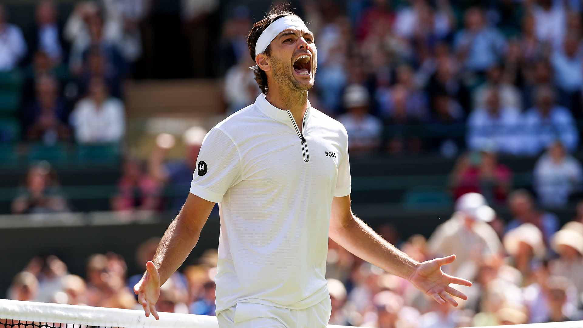Taylor Fritz defeats Karen Khachanov in four sets Tuesday to reach the Wimbledon semi-finals.