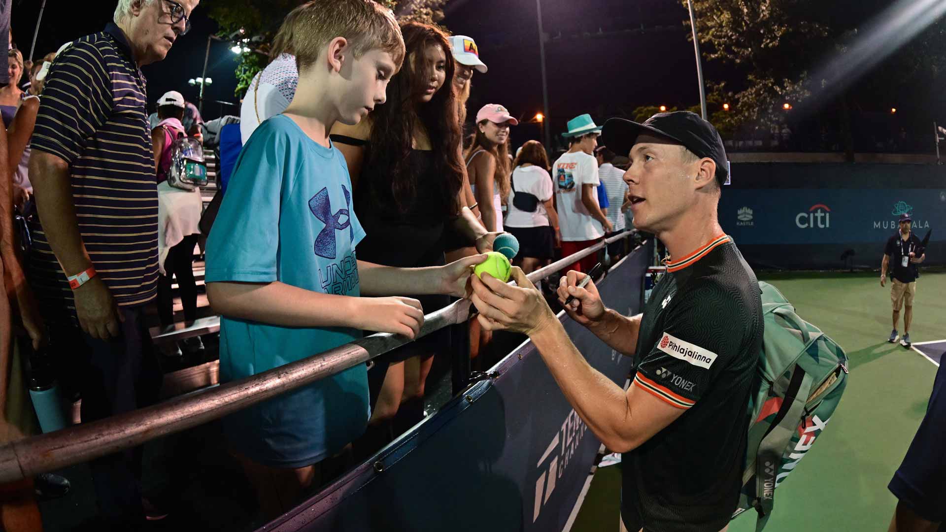 Harri Heliovaara speaks with a fan in Washington after a match.