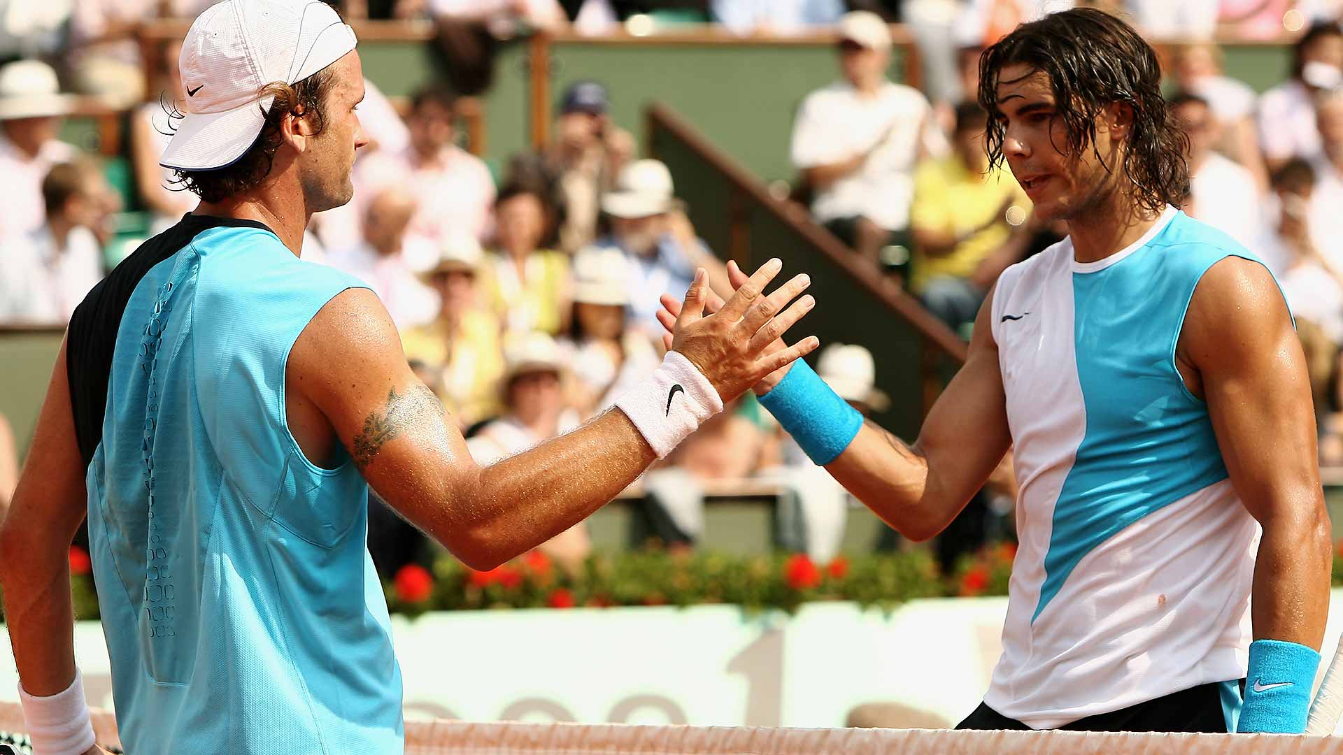 Carlos Moya gives Rafael Nadal a congratulatory handshake after Nadal's win in the 2007 Roland Garros Quarter-Finals
