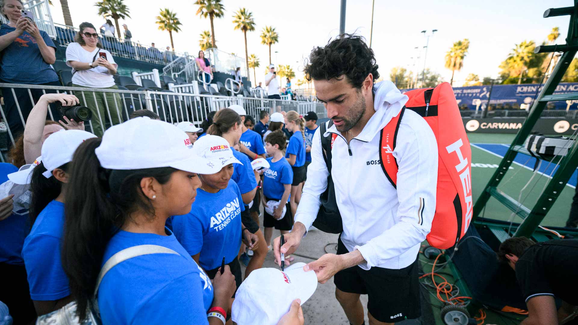 <a href='https://www.atptour.com/en/players/matteo-berrettini/bk40/overview'>Matteo Berrettini</a> signs autographs after his first-round win at the <a href='https://www.atptour.com/en/scores/archive/phoenix/9167/2024/results'>Arizona Tennis Classic</a>.
