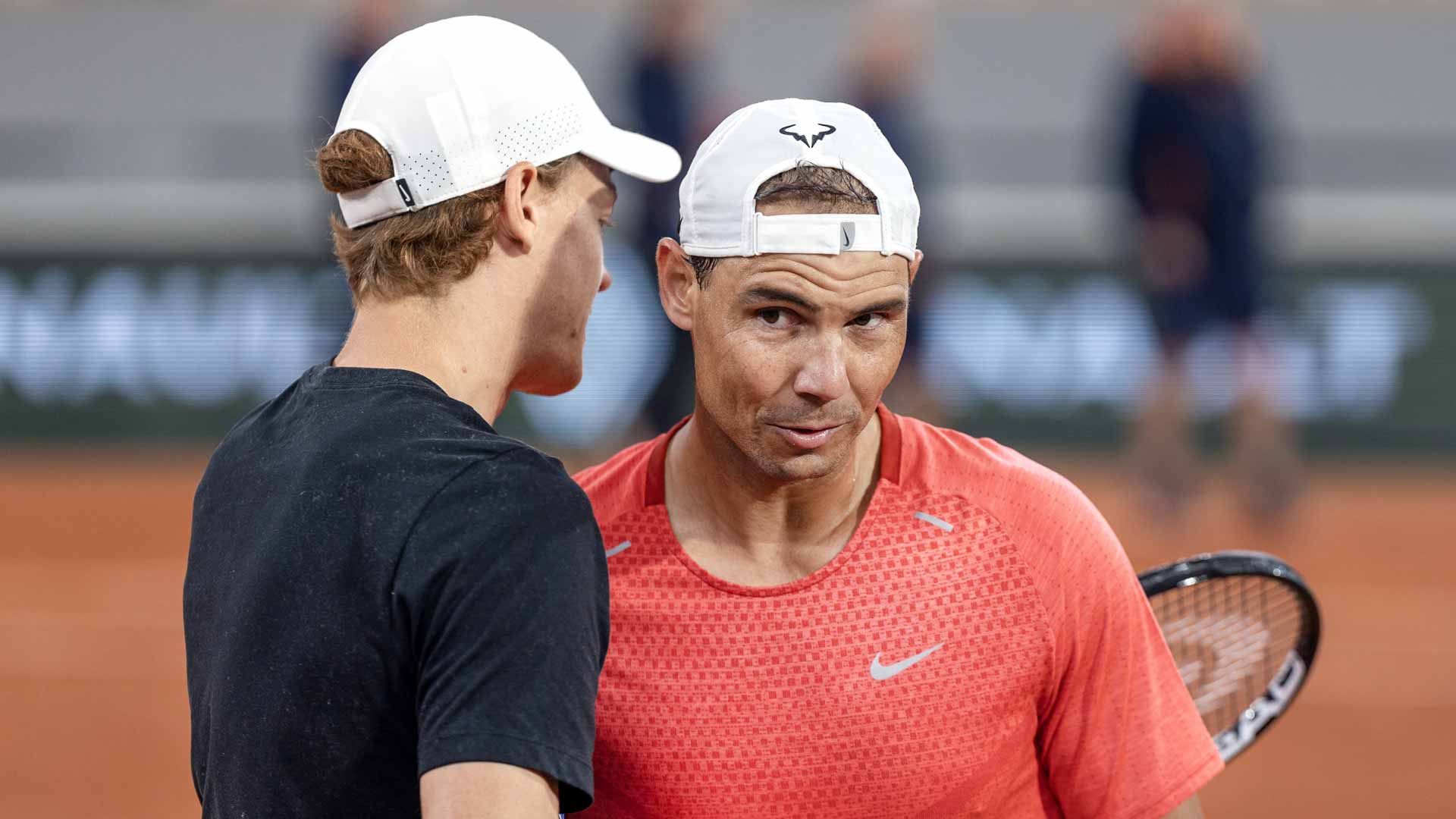 Jannik Sinner and Rafael Nadal share a warm embrace Wednesday at Roland Garros.
