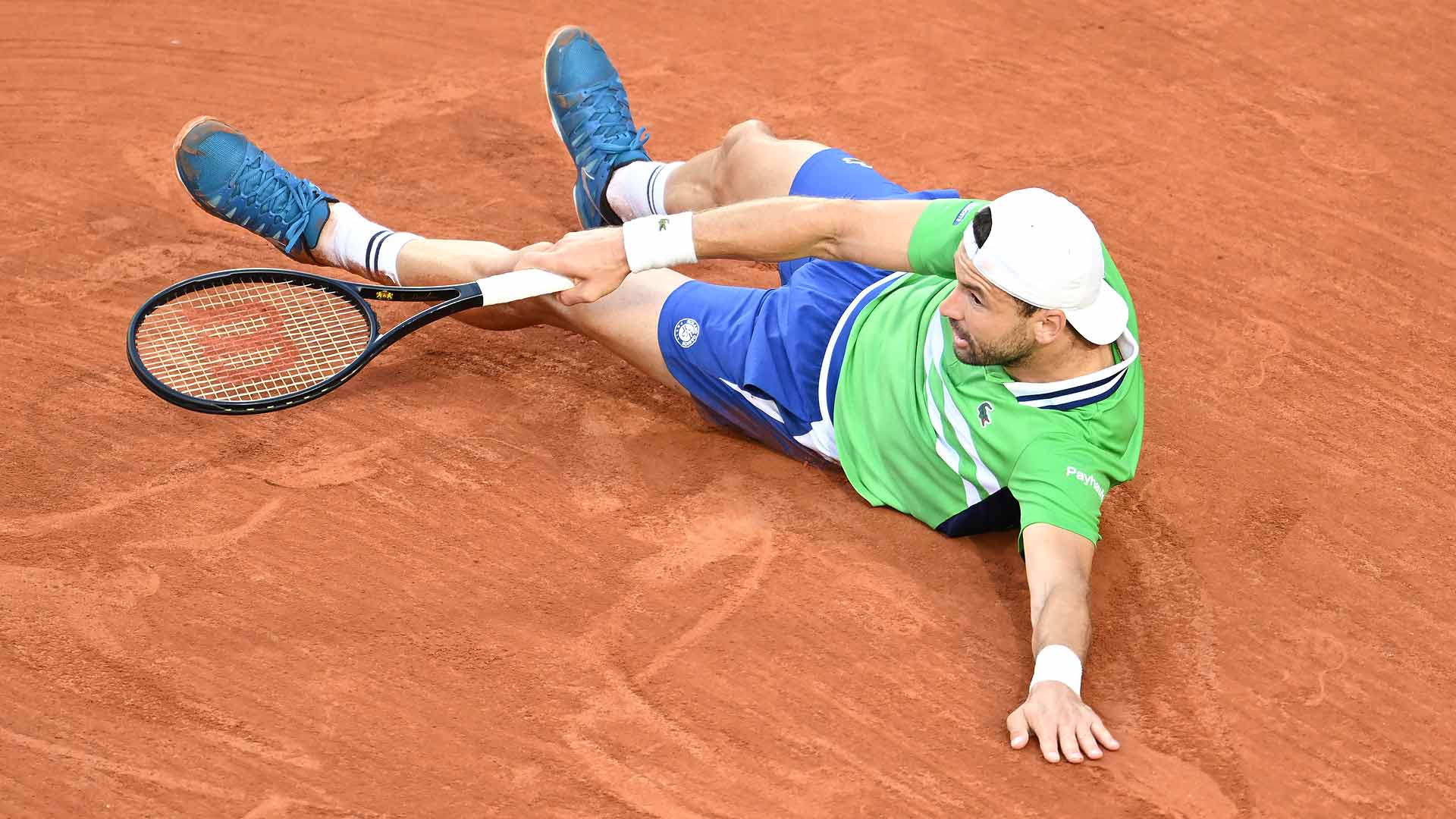 Grigor Dimitrov dives for a volley during his fourth-round clash with Hubert Hurkacz on Sunday at Roland Garros.