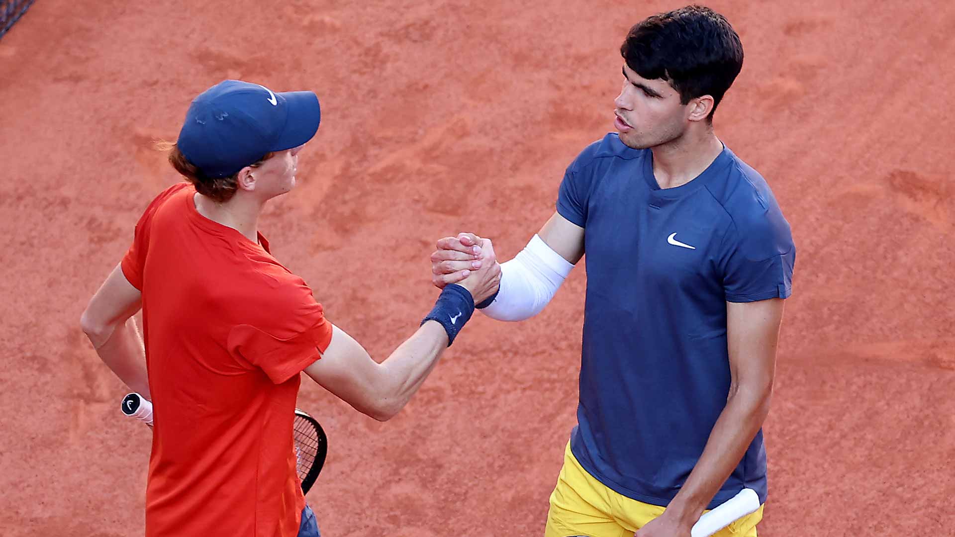 Jannik Sinner and Carlos Alcaraz shake hands after their five-set clash in the 2024 Roland Garros semi-finals.