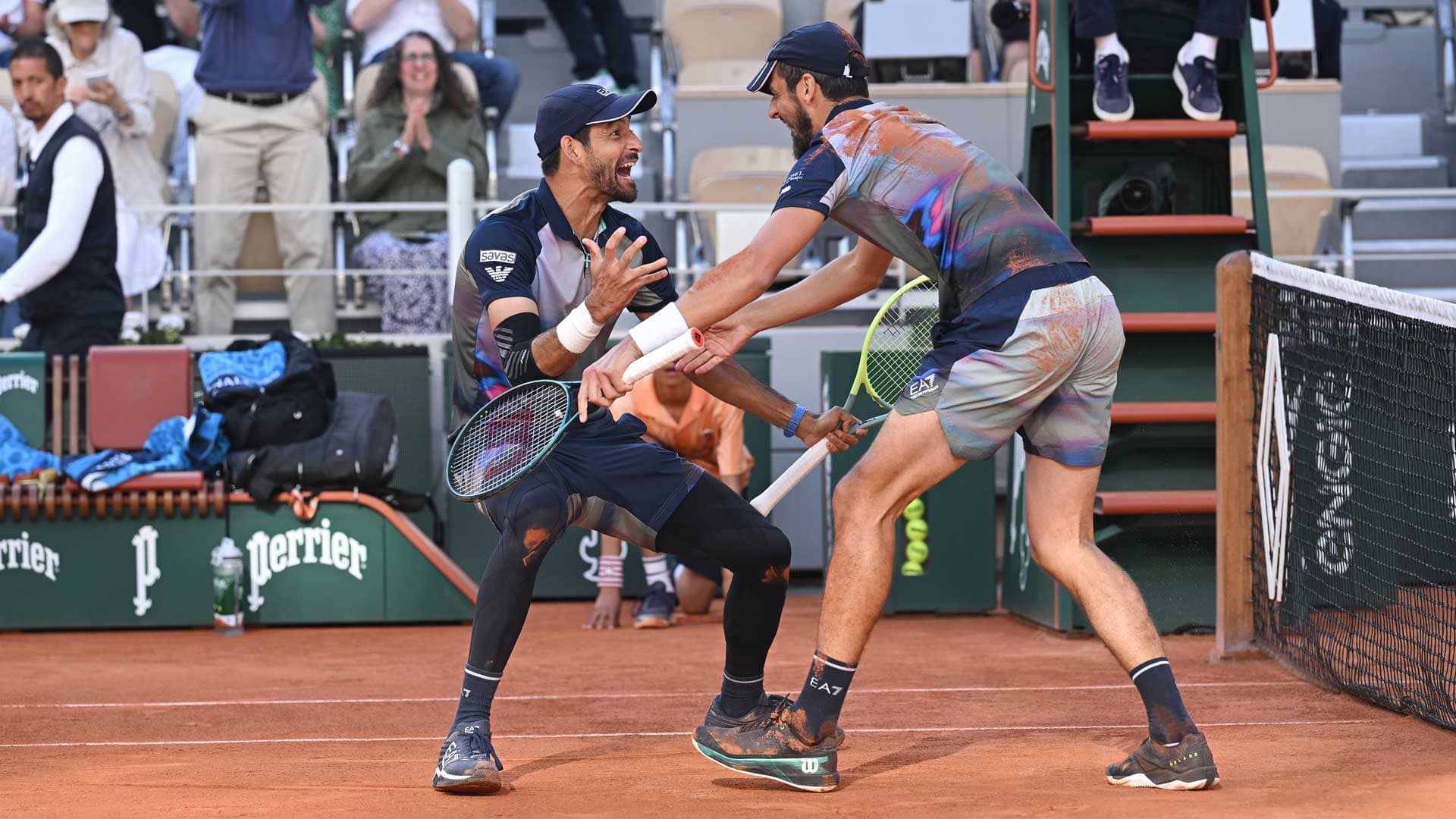 Marcelo Arevalo and Mate Pavic celebrate winning their first Grand Slam title as a team.