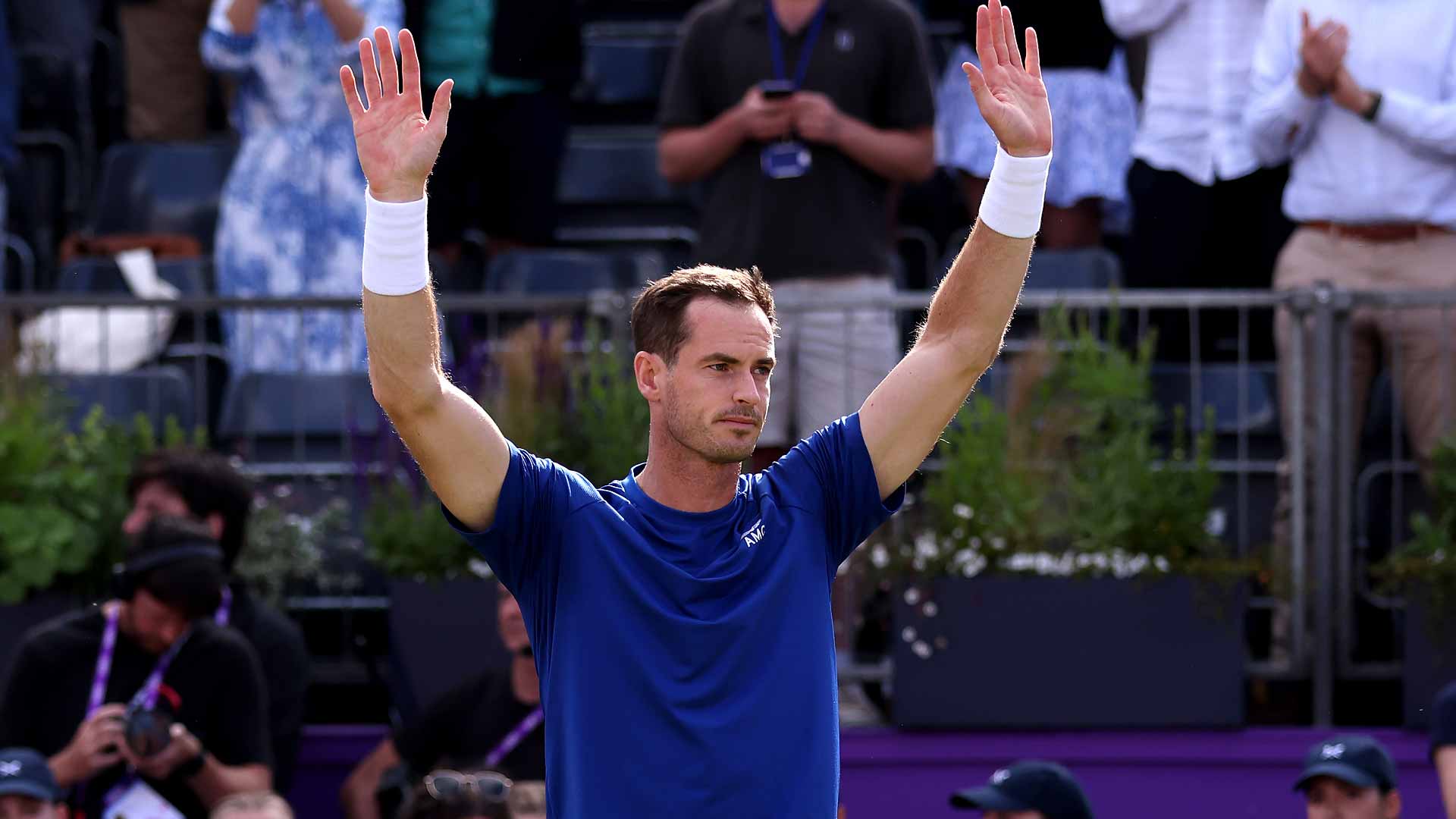 Andy Murray waves to the fans after being forced to retire on Wednesday at Queen's Club.