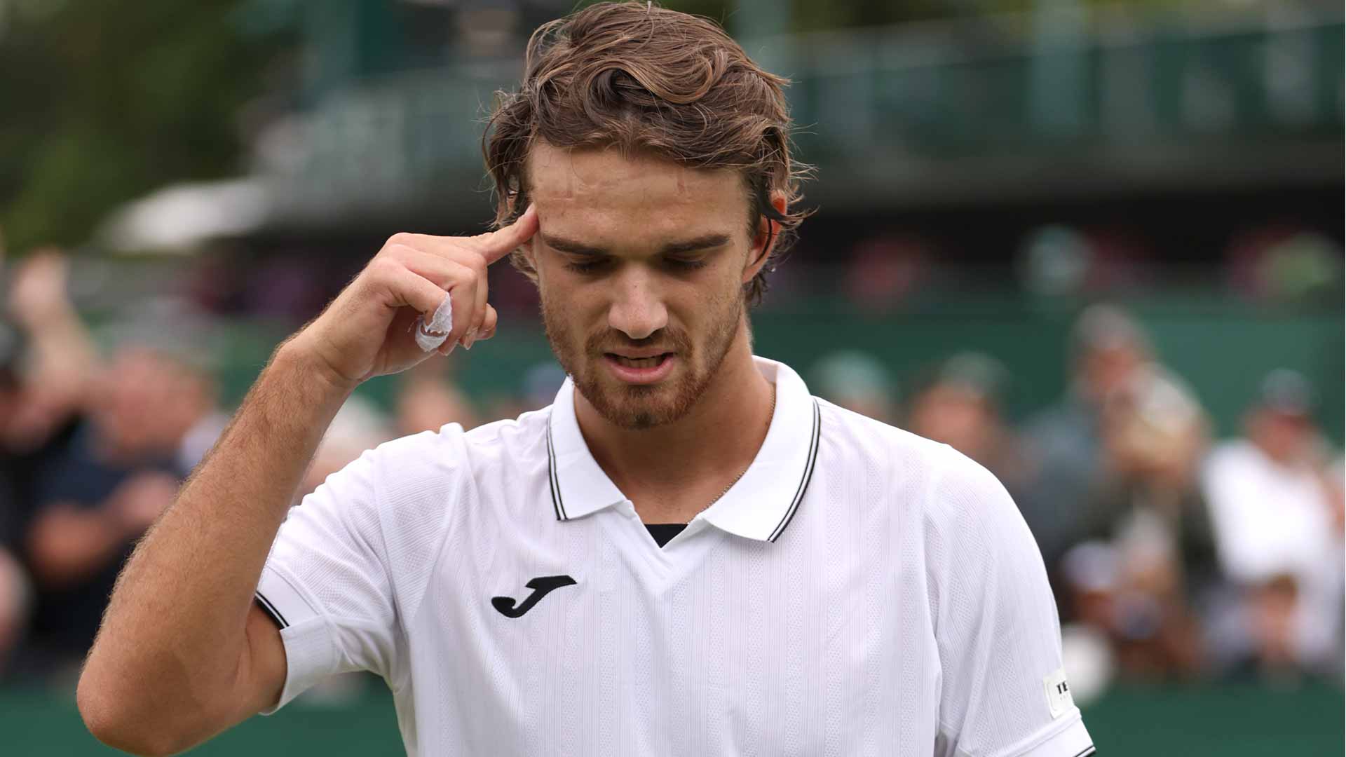 Tomas Machac defeats David Goffin in five sets in the first round at Wimbledon.