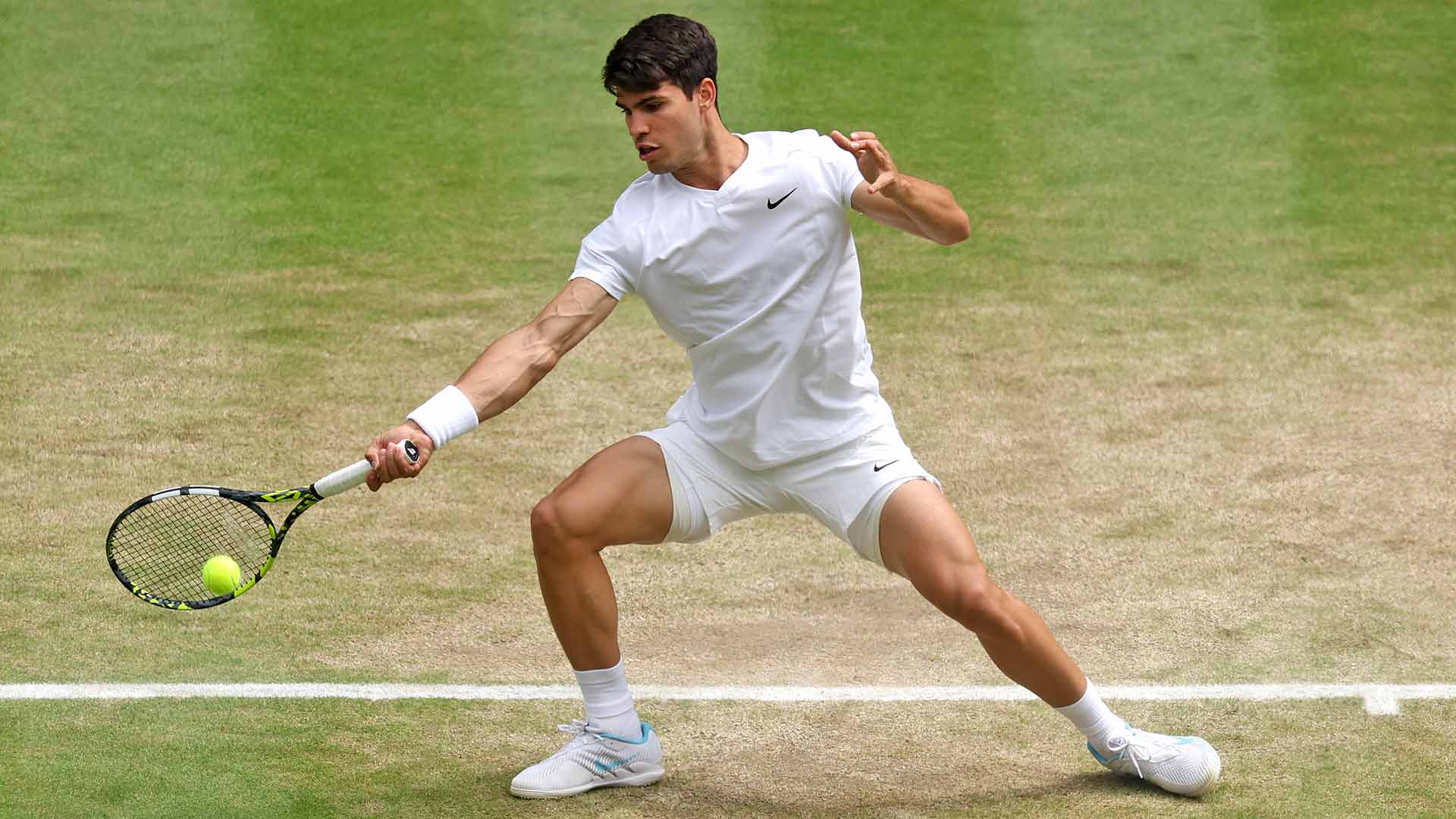 Carlos Alcaraz in semi-final action against Daniil Medvedev on Friday at Wimbledon.