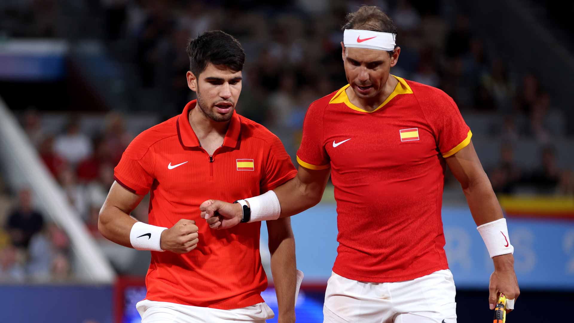 Carlos Alcaraz and Rafael Nadal in action Saturday at the Paris 2024 Olympics.