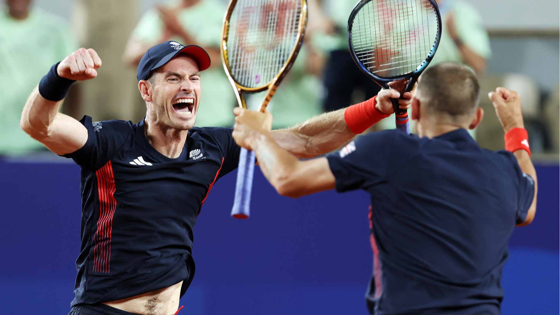 Andy Murray and Daniel Evans celebrate their second-round victory against Sander Gille and Joran Vliegen Tuesday evening in Paris.