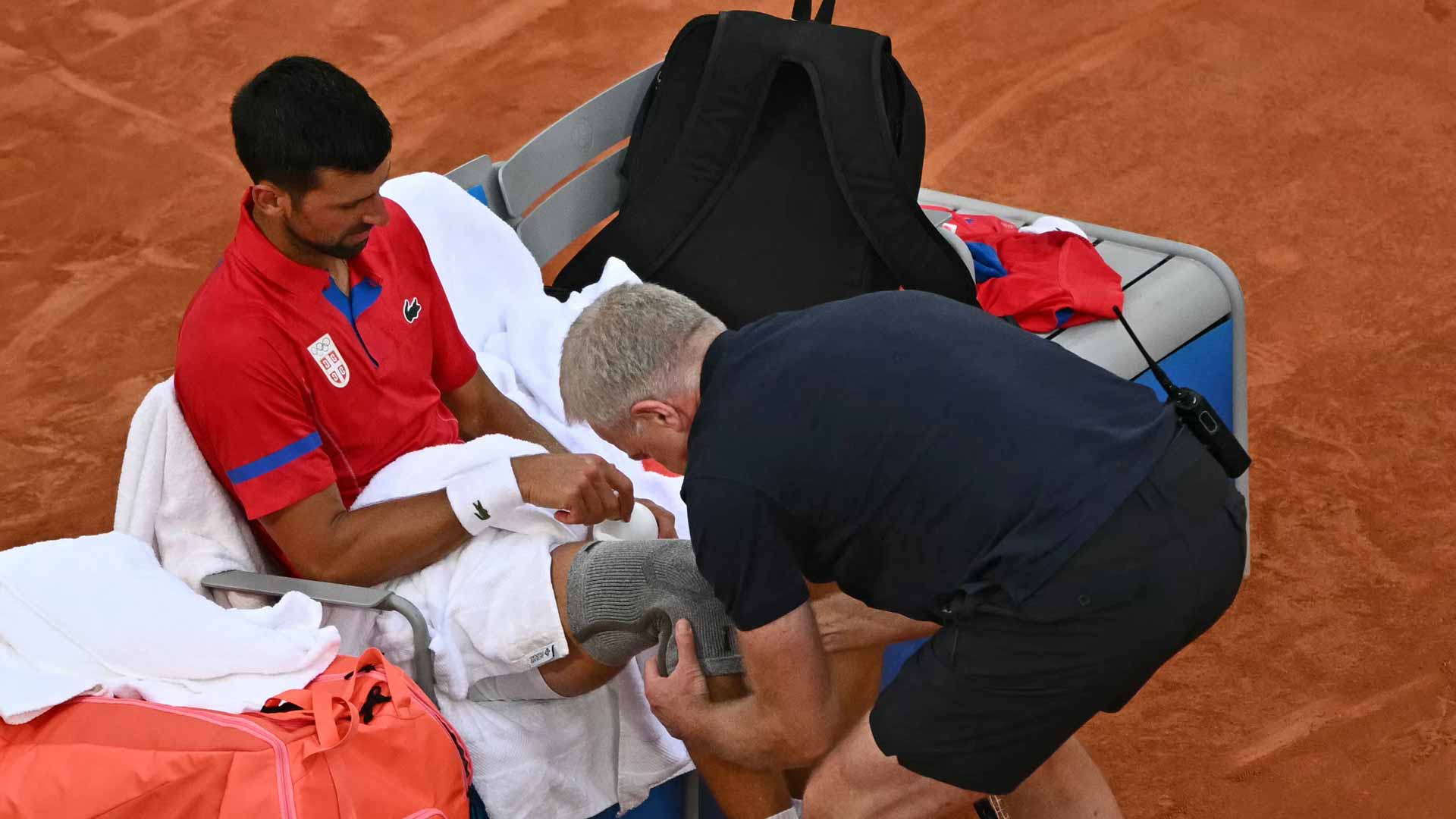 <a href='https://www.atptour.com/en/players/novak-djokovic/d643/overview'>Novak Djokovic</a> visits with the physio Thursday at the <a href='https://www.atptour.com/en/scores/archive/paris/96/2024/results'>Paris Olympics</a>.