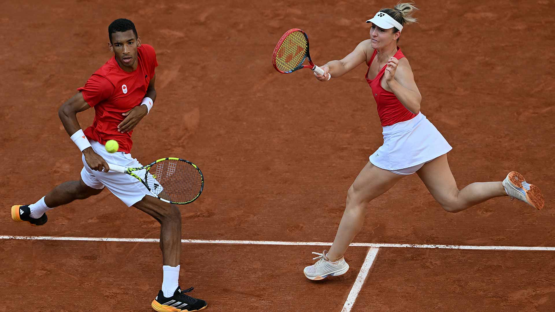 Felix Auger-Aliassime and Gabriela Dabrowski on their way to collecting mixed doubles bronze at the Paris Olympics.