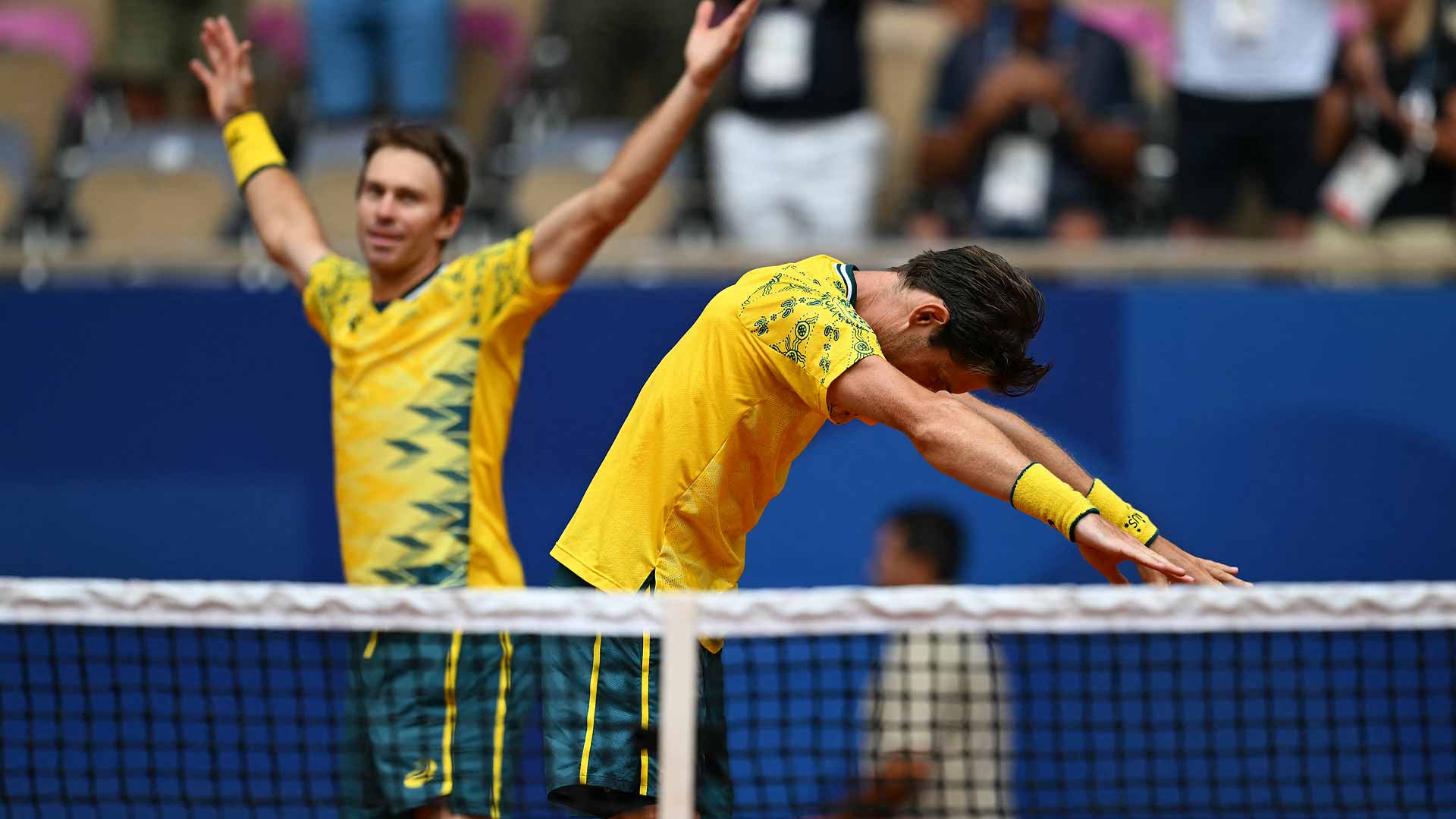 John Peers and Matthew Ebden celebrate after winning gold on Saturday at the Paris Olympics.