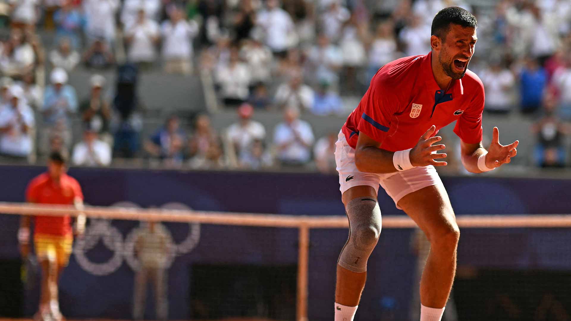 Novak Djokovic celebrates the moment he clinches the gold medal at the Paris Olympics.