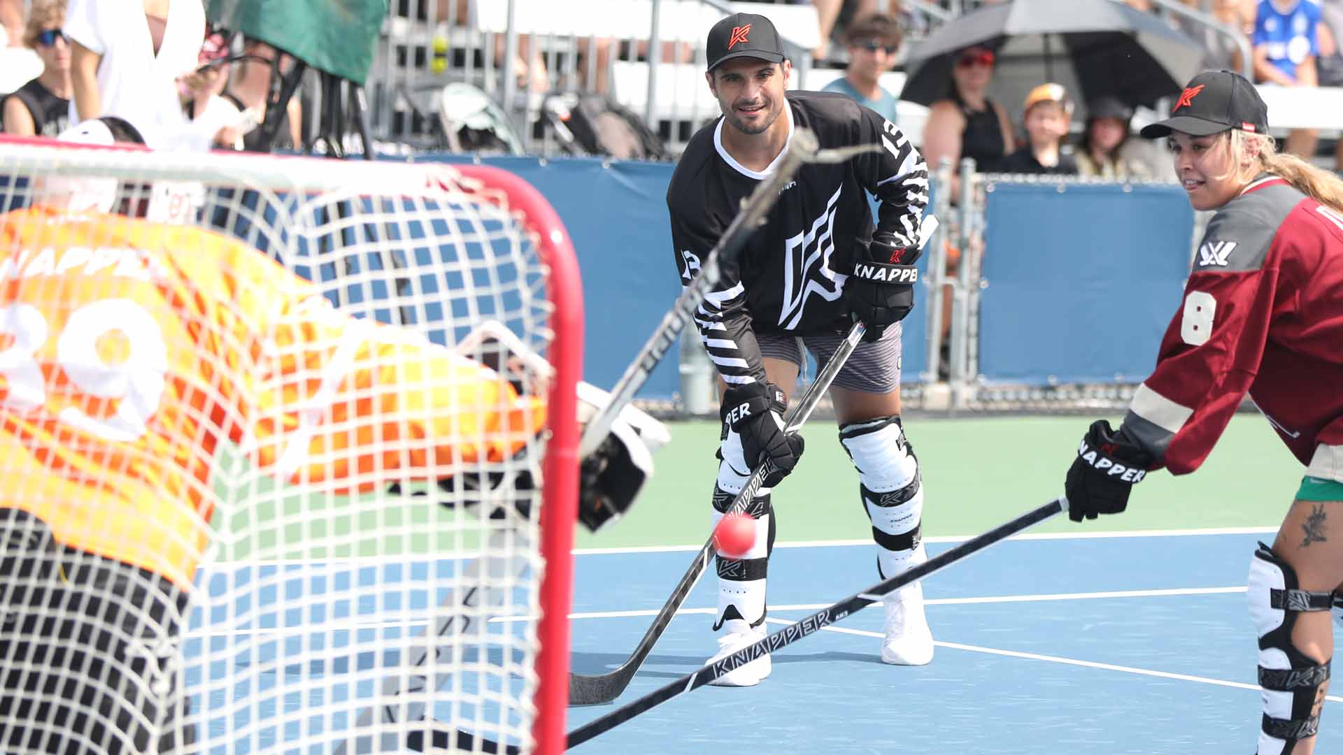 <a href='https://www.atptour.com/en/players/marcos-giron/gc88/overview'>Marcos Giron</a> plays ball hockey Saturday in Montreal.