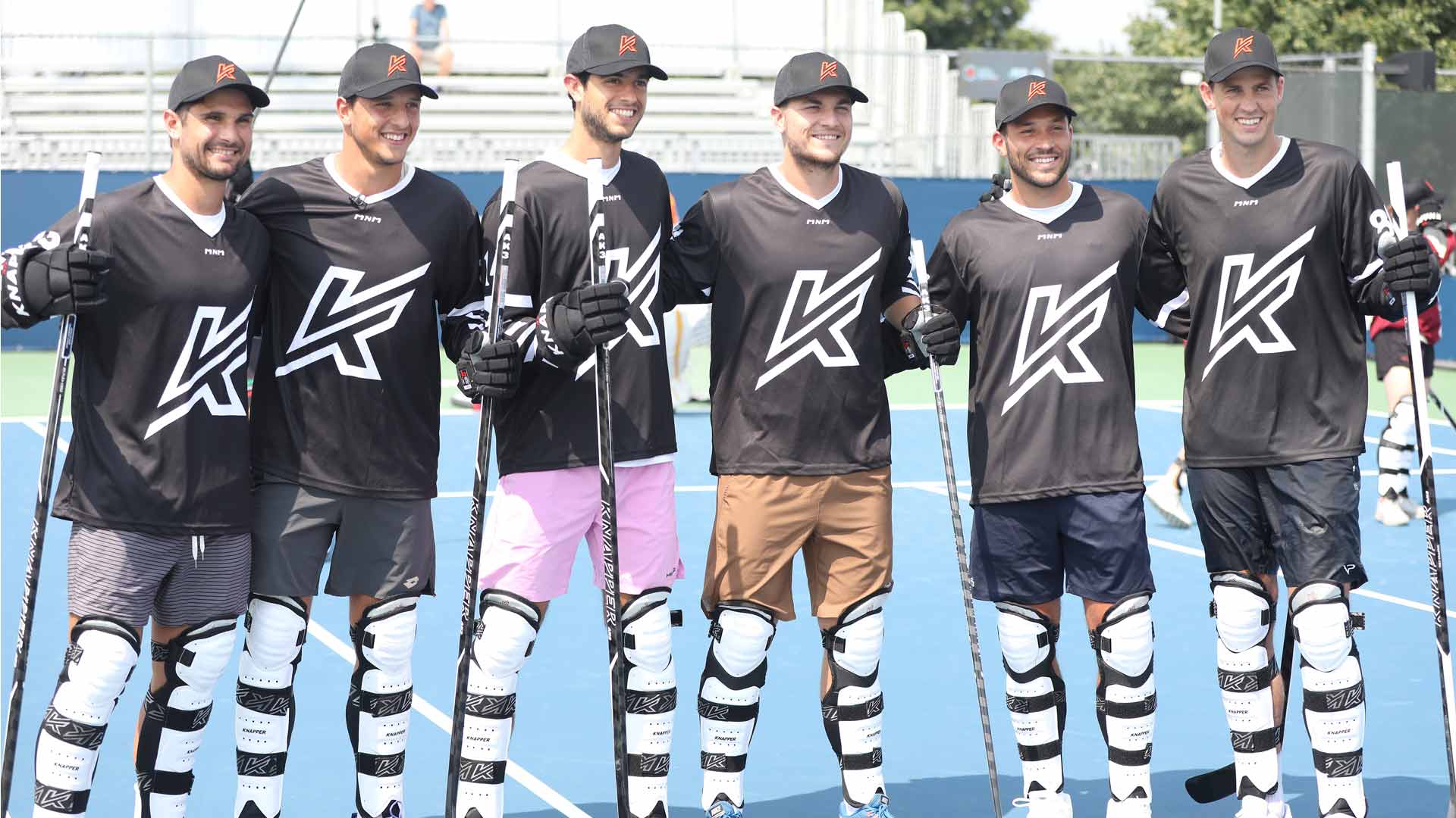 Marcos Giron, Luciano Darderi, Nuno Borges, Miomir Kecmanovic, Alexis Galarneau and Vasek Pospisil enjoy ball hockey on Saturday in Montreal.