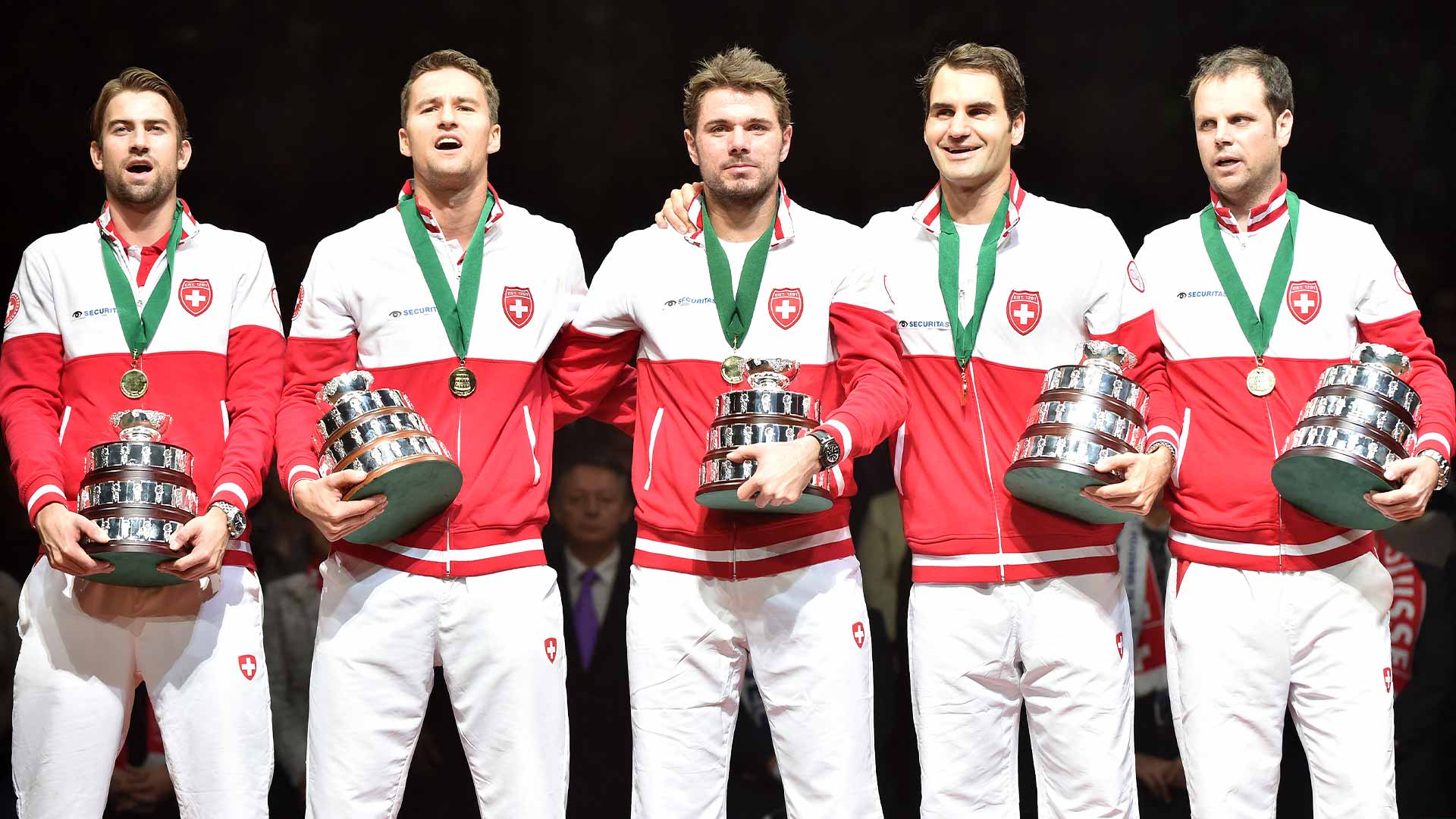 <a href='https://www.atptour.com/en/players/michael-lammer/l523/overview'>Michael Lammer</a>, <a href='https://www.atptour.com/en/players/marco-chiudinelli/c582/overview'>Marco Chiudinelli</a>, <a href='https://www.atptour.com/en/players/stan-wawrinka/w367/overview'>Stan Wawrinka</a>, <a href='https://www.atptour.com/en/players/roger-federer/f324/overview'>Roger Federer</a> and <a href='https://www.atptour.com/en/players/severin-luthi/l317/overview'>Severin Luthi</a> celebrate winning the Davis Cup in 2014.
